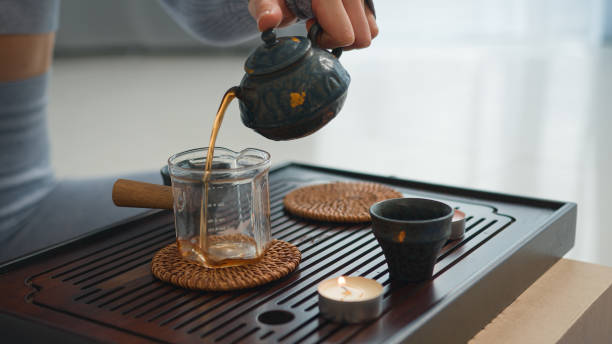 istock Close up pour black tea ceremony cup drink relaxation freshness refreshment meditation antioxidant beverage detail culture harmony health herbal energy liquid pure teapot hot comfortable break rest 2192213869