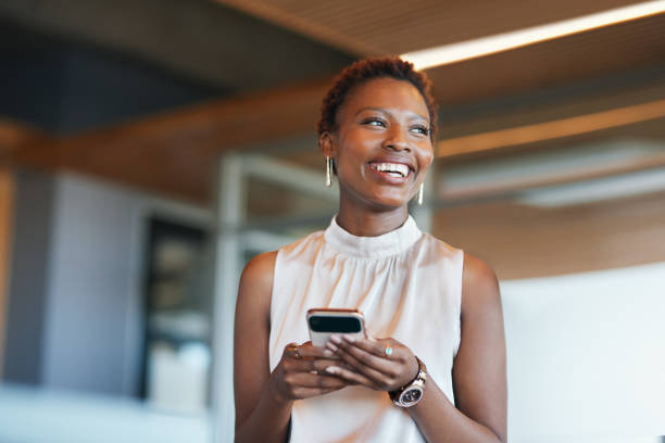 Smiling Businesswoman with Smartphone