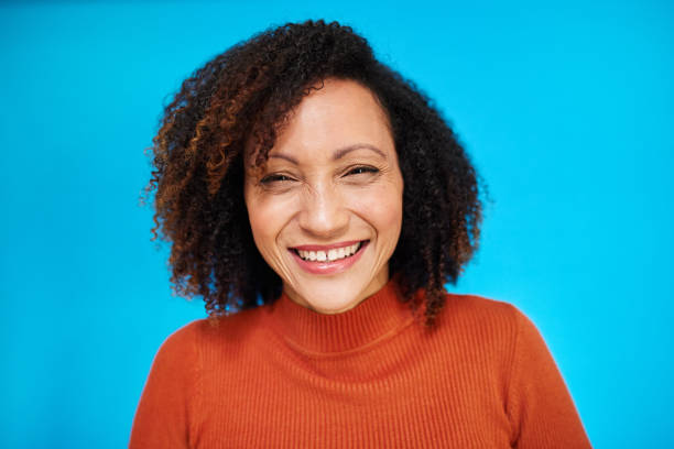 istock Joyful Woman with Curly Hair on Blue 2192217375