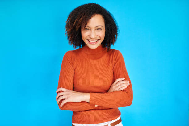 istock Radiant Confidence: Smiling Woman on Blue 2192217389