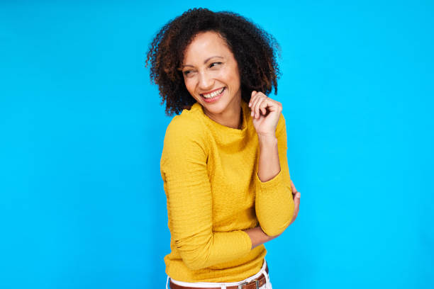 istock Joyful Gaze: Smiling Woman on Blue 2192217413