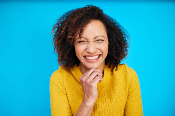 istock Joyful Woman Bursting with Laughter 2192217420