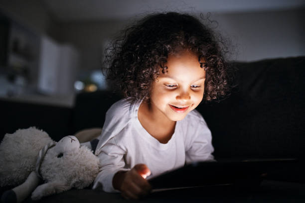 istock Enchanted Glow: Child Lost in Digital World 2192217458