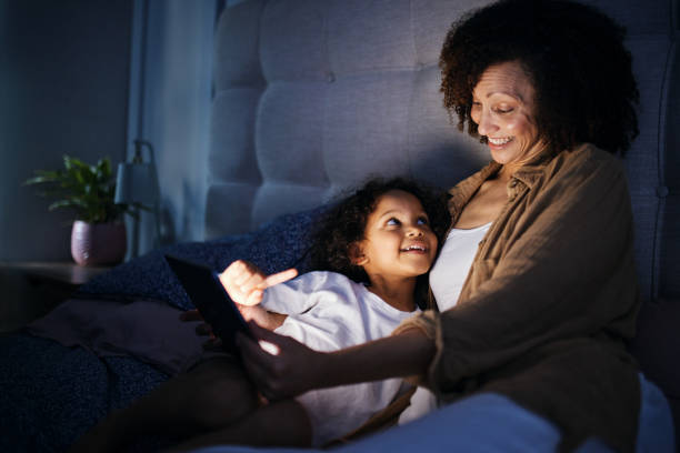 istock Bedtime Story Glow: Mother and Child Bonding 2192217464