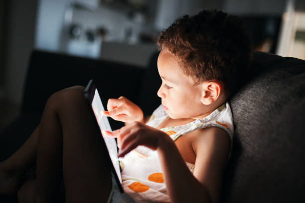 istock Focused Youngster Engrossed in Tablet 2192217503