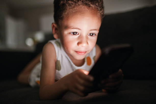 istock Focused Young Gamer Immersed in Mobile Fun 2192217513