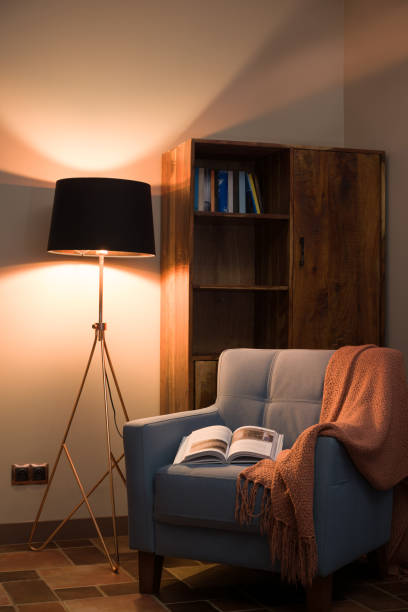 Cozy Reading Corner with Armchair, Book, and Lamp