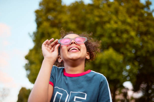 istock Joyful Gaze: Girl with Pink Sunglasses 2192218068
