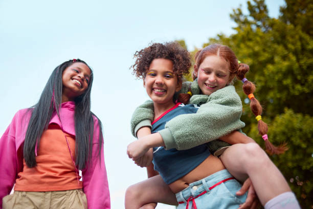 istock Joyful Piggyback Ride with Friends 2192218081