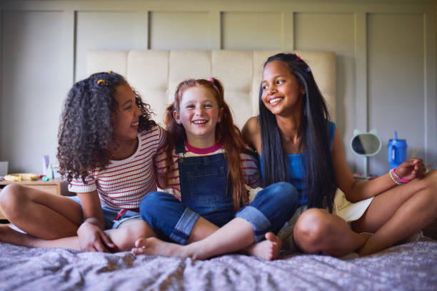 istock Giggles and Friendship on a Cozy Bed 2192218148
