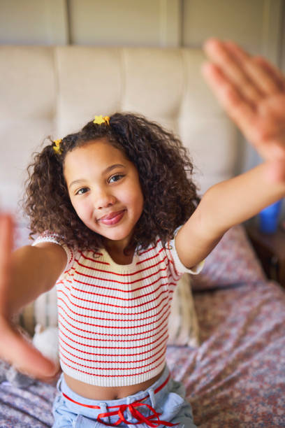 istock Playful Girl Reaching for a Selfie 2192218199