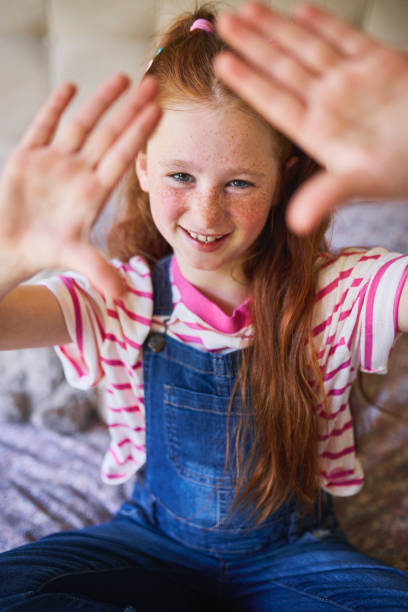 istock Framed by Joy: Girl with Hands Outstretched 2192218222