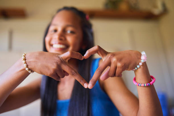 Girl Making Heart Shape with Hands