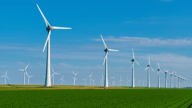 istock Wind Energy Harvesting at Dusk in the Netherlands With Turbines Illuminated by Setting Sun 2192220583