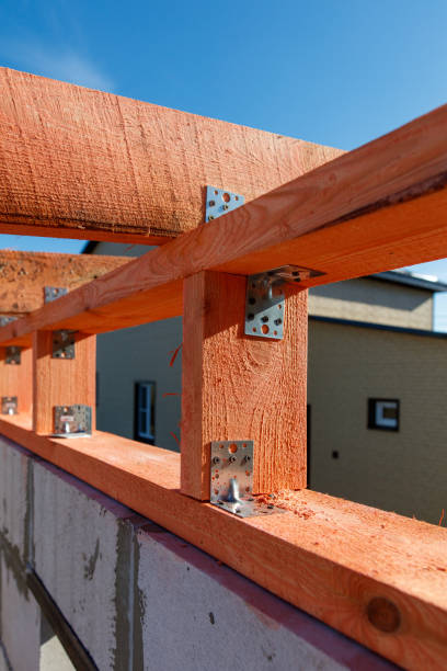 istock A wooden beam is being held up by metal brackets 2192221469