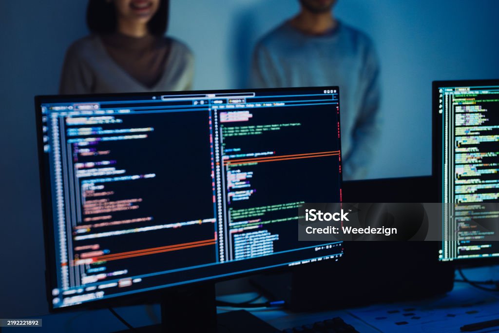 Asian Two Software Developers Engaged In Collaborative Coding Session ...