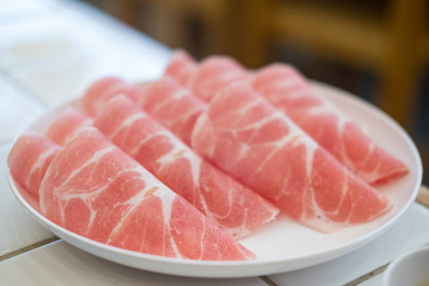 istock Thinly sliced pork for hotpot, detailed marbling and fat. 2192222912