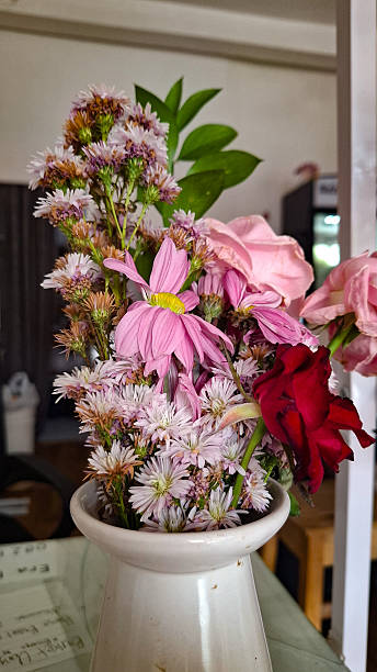 A Charming Vase of Mixed Blooms in Soft Hues