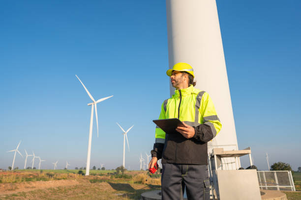 istock Engineer  inspection and survey work in wind turbine farms. 2192224575