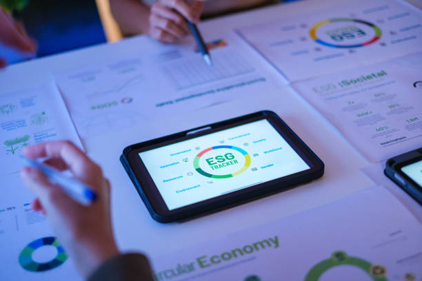 istock close up diversity team brainstorming focused on ESG (environment,social,governance)  with tablet or sdgs goals in a sustainable green office at night 2192224628
