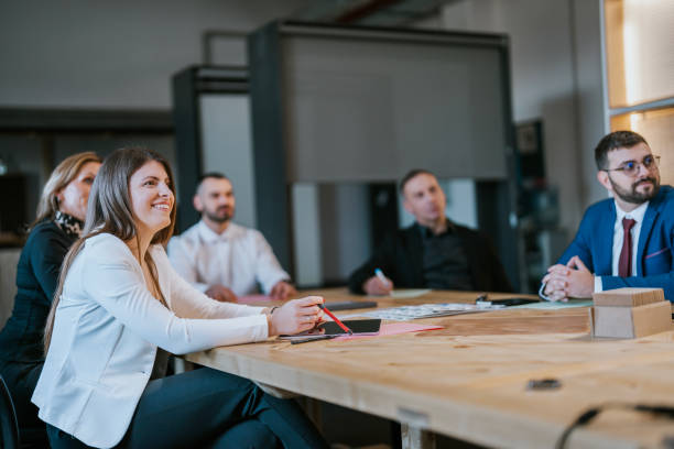 Group of professionals discussing ideas during a workplace meeting