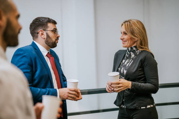 istock Business professionals engaging in casual conversation during a coffee break 2192225667