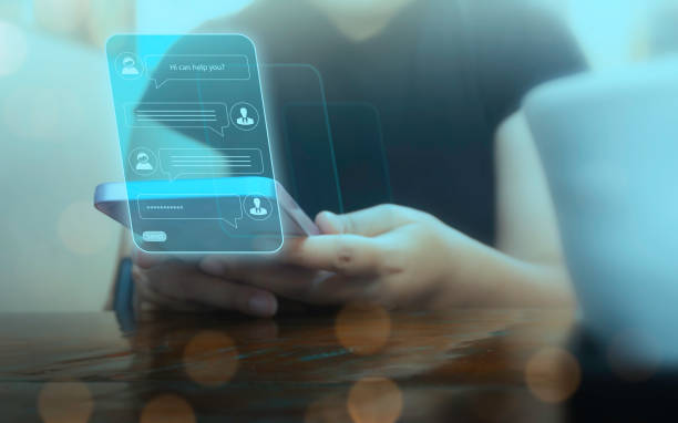 istock Person using online customer service with chatbot to get support. AI automatic answering machine. Artificial intelligence, customer support center, contact us concept. 2192228447