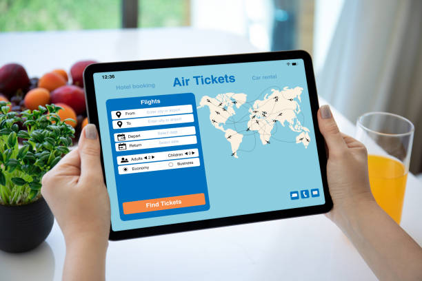 istock female hands holding computer tablet with application searching air tickets 2192228954