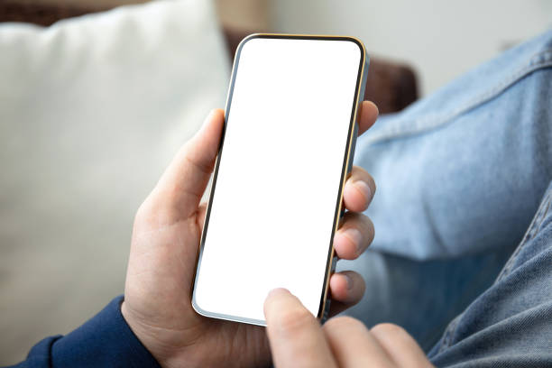 istock male hands holding phone with isolated screen on denim pants 2192228966