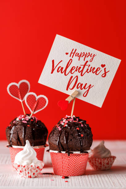 istock Cupcake love: Heart-themed treats on a vibrant red backdrop 2192228974