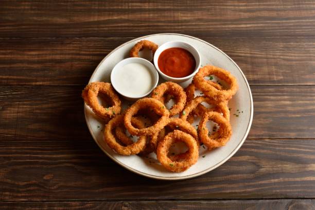 istock Fried breaded onion rings served with sauce 2192229343