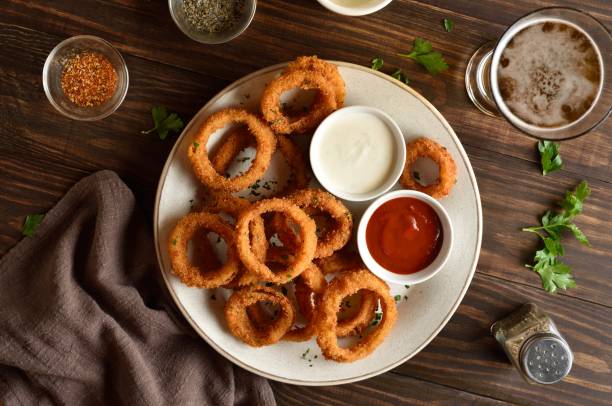 istock Fried breaded onion rings served with sauce 2192229351