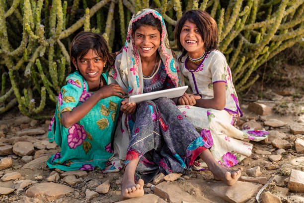 istock Happy Indian girls using a digital tablet, India 2192230725