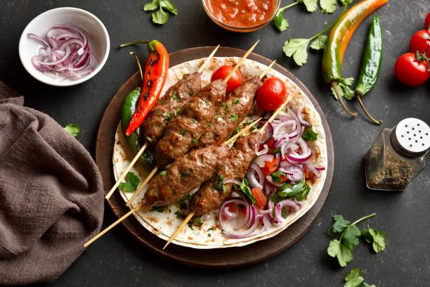 istock Grilled lula kebab with fresh vegetables on flat bread 2192232187