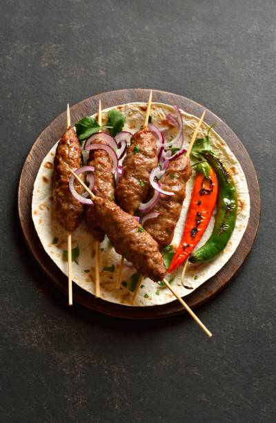 istock Grilled lula kebab with fresh vegetables on flat bread 2192232189
