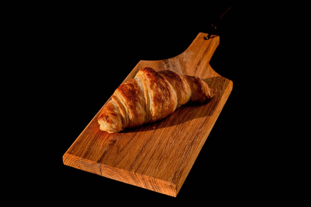 istock Freshly baked croissant on a black background 2192232540