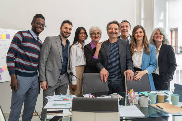 istock Team diversity celebration in modern startup office with multiethnic business professionals enjoying successful meeting 2192232682