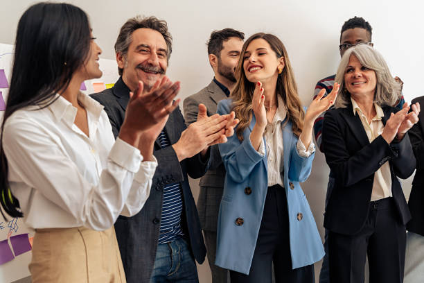 istock Enthusiastic multicultural business team celebrating success modern office diverse workforce authentic professional achievement 2192232781