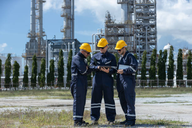 istock Engineer working using tablet together at station refining oil petrochemical. Technician worker check quality oil industry factory. Inspector standing at zone gas with refinery building background. 2192235541