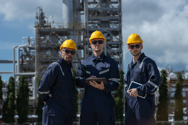 istock Engineer working using tablet together at station refining oil petrochemical. Technician worker check quality oil industry factory. Inspector standing at zone gas with refinery building background. 2192235544