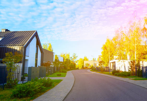 Barn House in gated community. Modern Scandinavian Barnhouse. Modern Architecture, luxury house in suburb. Suburban Scandi home. Contemporary barnhouse in. Barn house with fence, lawn at street road.