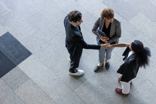 istock Top angle view. businesspeople handshake agreement success. professional cooperation partner connection support. executive shake hands and reach agreement. 2192238883