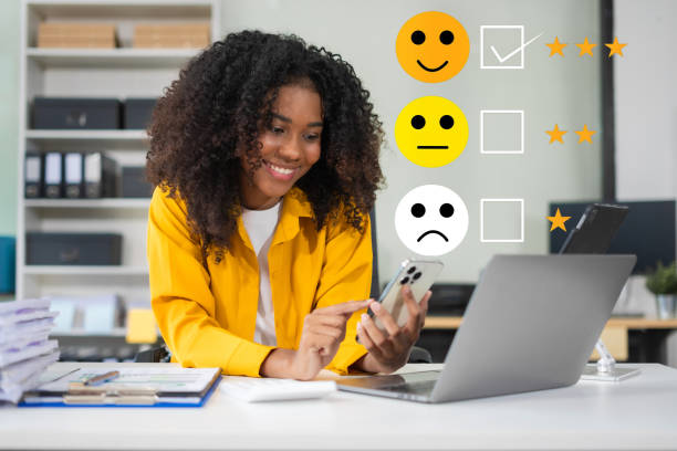 istock Happy Client customer experience concept. Woman recording phone inquiry with checkboxes, smiling face rating excellent for satisfaction survey. 2192238917