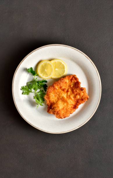 istock Schnitzel with lemon and leaves of parsley 2192240853