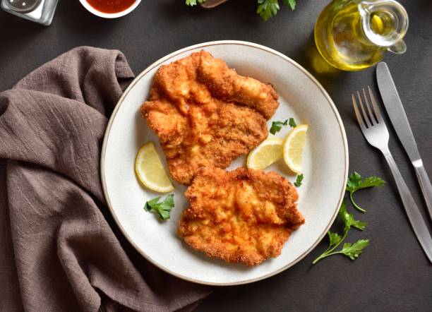 istock Schnitzel with lemon and leaves of parsley 2192240863