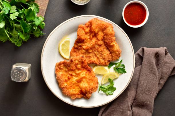 istock Schnitzel with lemon and leaves of parsley 2192240866