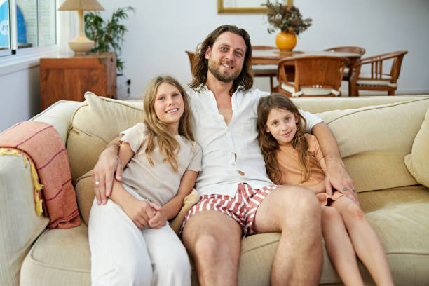 istock Relaxed portrait of father and young daughters 2192242526