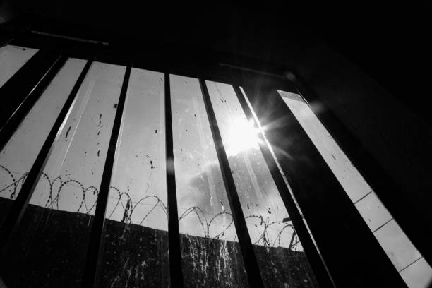 istock Freedom's Glimmer: A Ray of Hope Amidst Confinement 2192243335