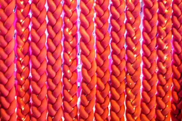 stylish blurred red background of braided ropes