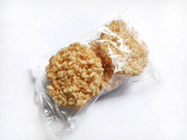istock Rengginang or rice cracker, traditional snacks made from glutinous rice, savory and crunchy. Rice crackers packed in a plastic wrap. Indonesian food. 2192244060